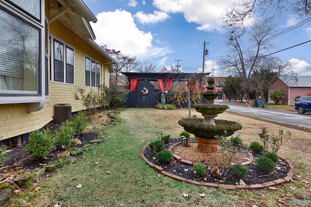 view of yard featuring central AC unit