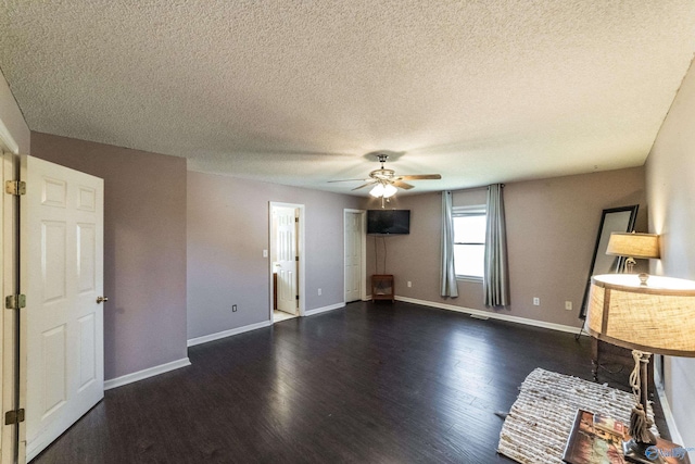 interior space featuring a textured ceiling, dark hardwood / wood-style flooring, and ceiling fan