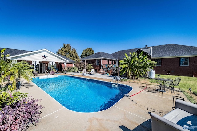 view of pool featuring a patio area