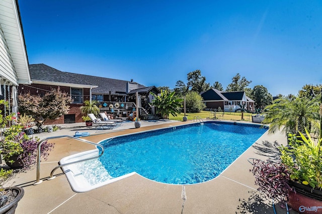 view of pool featuring a patio area