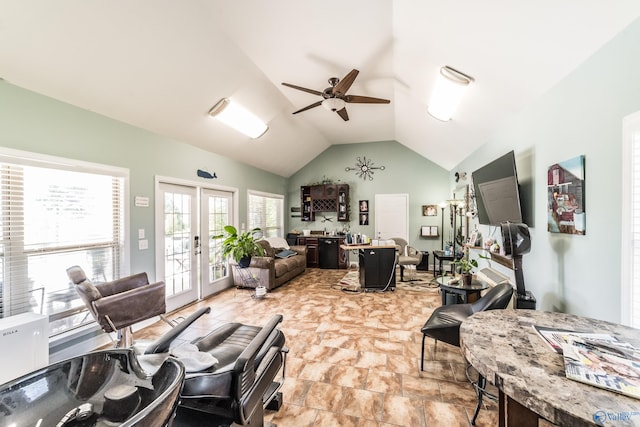 living room featuring ceiling fan, vaulted ceiling, and french doors