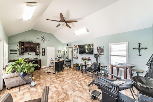 living room featuring ceiling fan and lofted ceiling