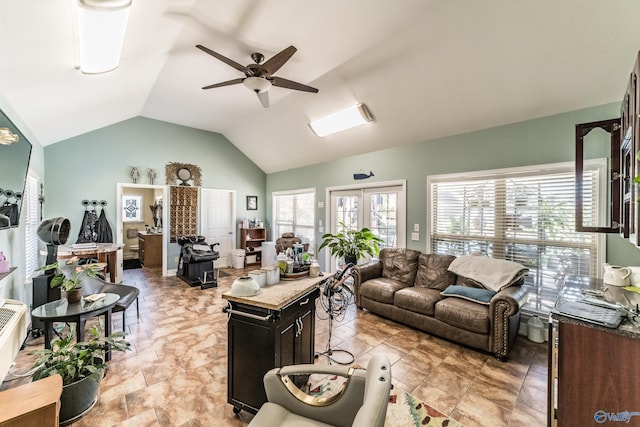 living room with ceiling fan, french doors, and vaulted ceiling