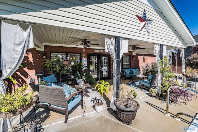 view of patio / terrace with ceiling fan and an outdoor living space