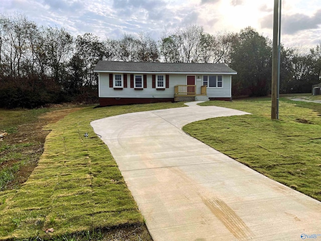 ranch-style house with a front lawn