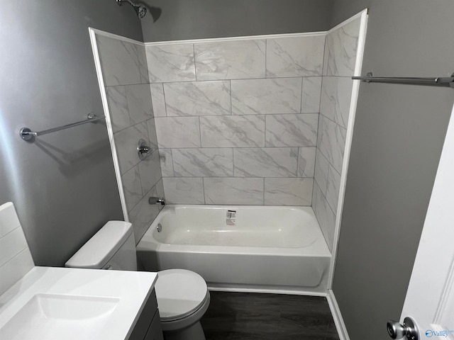 full bathroom featuring vanity, toilet, and tiled shower / bath