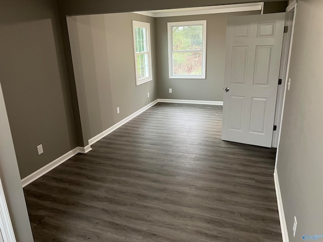 unfurnished bedroom with dark wood-type flooring