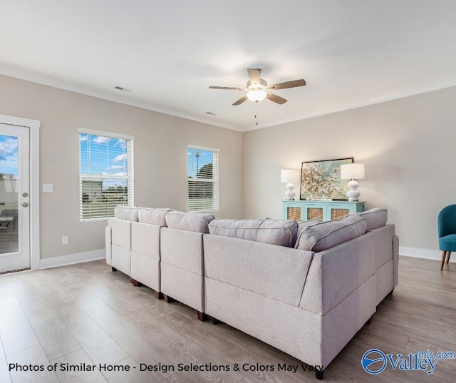 1112 Hine St, Athens, AL 35611 - living room featuring crown molding, ceiling fan, and light hardwood / wood-style floors