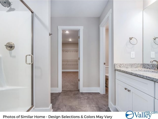 1112 Hine St, Athens, AL 35611 - bathroom with vanity, a shower with shower door, and toilet