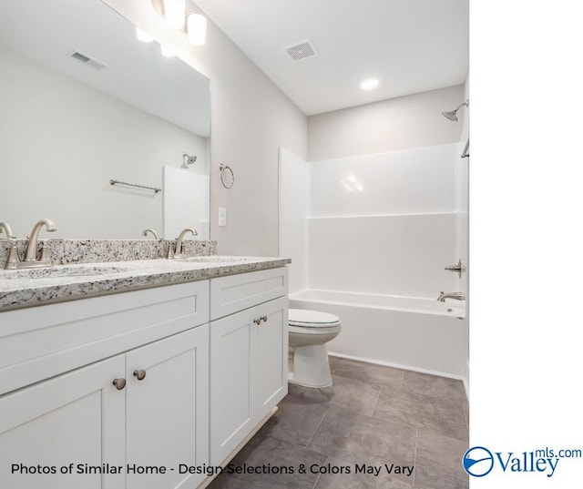 full bathroom featuring vanity, shower / tub combination, and toilet