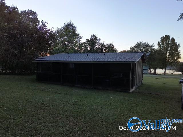 rear view of house with a yard