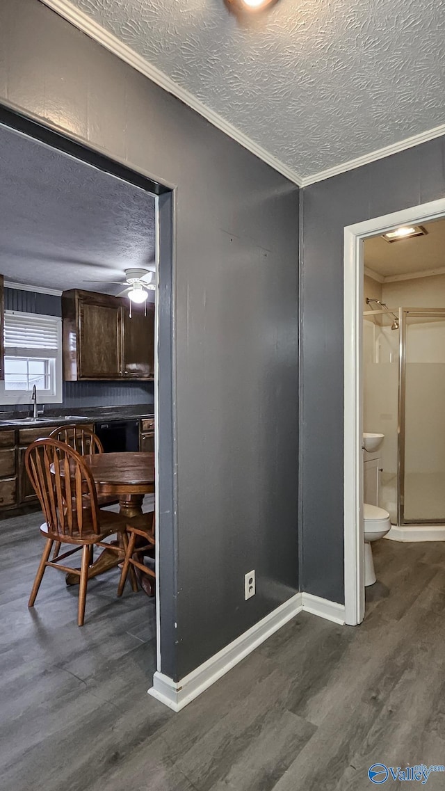18222 Mcmunn Ln, Athens, AL 35614 - dining room featuring sink, ornamental molding, dark hardwood / wood-style floors, and a textured ceiling
