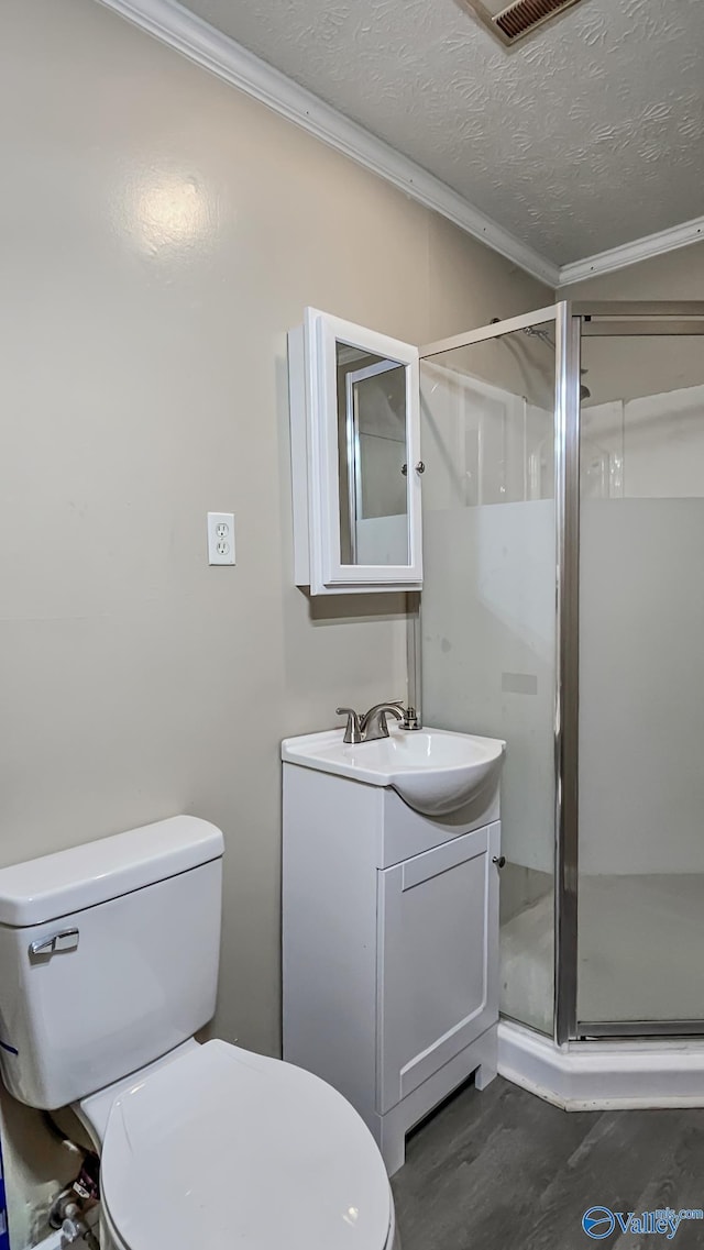 18222 Mcmunn Ln, Athens, AL 35614 - bathroom featuring walk in shower, toilet, a textured ceiling, ornamental molding, and vanity
