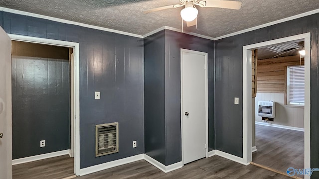 18222 Mcmunn Ln, Athens, AL 35614 - interior space with heating unit, ornamental molding, and dark hardwood / wood-style floors