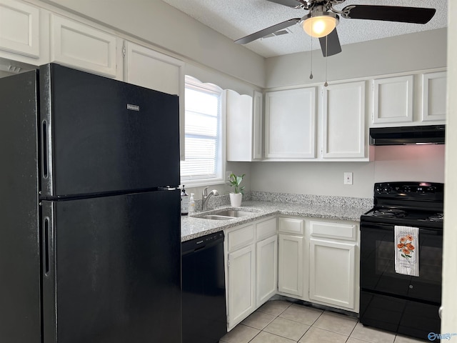 kitchen with black appliances, under cabinet range hood, white cabinets, and a sink