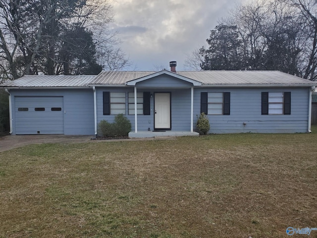 ranch-style house with an attached garage, driveway, metal roof, and a front yard