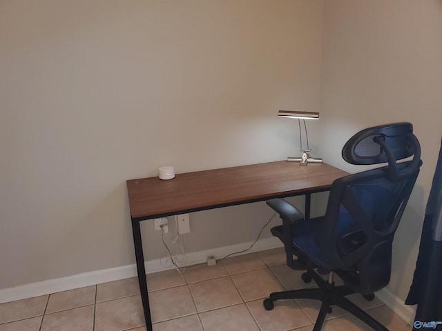 office area with baseboards and tile patterned floors