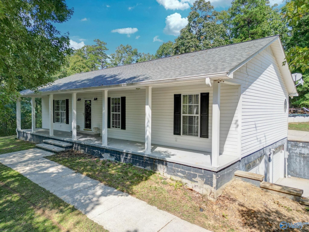 view of front of property with a garage and covered porch