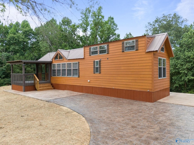 back of house featuring a patio