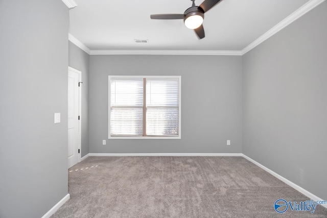 carpeted empty room with ceiling fan and crown molding