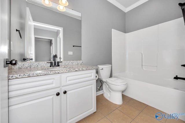 full bathroom with washtub / shower combination, tile patterned flooring, toilet, vanity, and ornamental molding