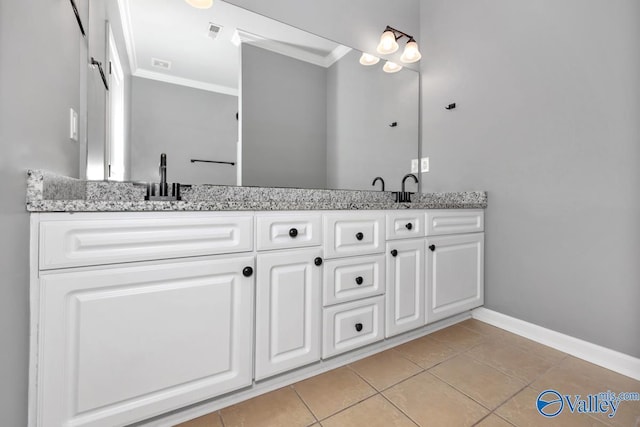 bathroom featuring tile patterned flooring, vanity, and ornamental molding