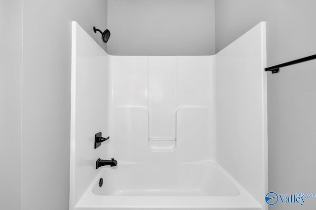 bathroom with washtub / shower combination