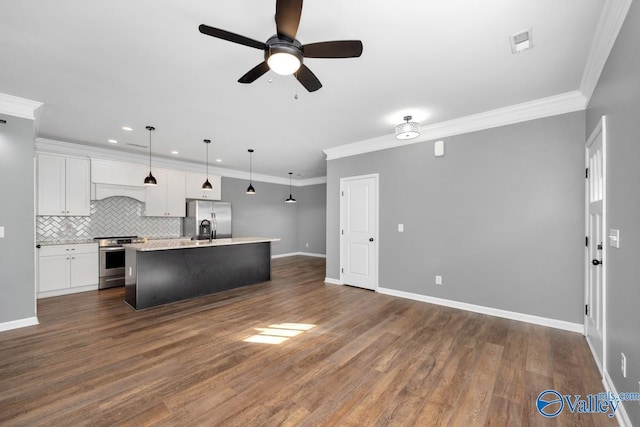 kitchen with white cabinetry, crown molding, pendant lighting, a center island with sink, and appliances with stainless steel finishes