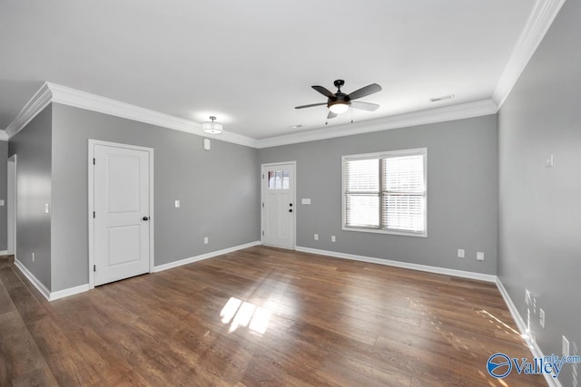 interior space with ceiling fan, dark hardwood / wood-style floors, and ornamental molding