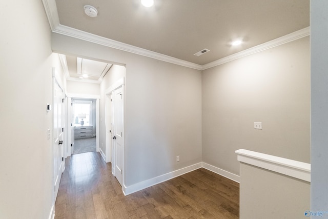 hallway featuring dark hardwood / wood-style floors and ornamental molding