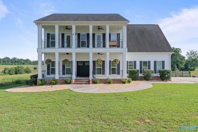 254 Whitlow Rd, Decatur, AL 35603 - greek revival inspired property with ceiling fan, a balcony, a front yard, a shingled roof, and covered porch