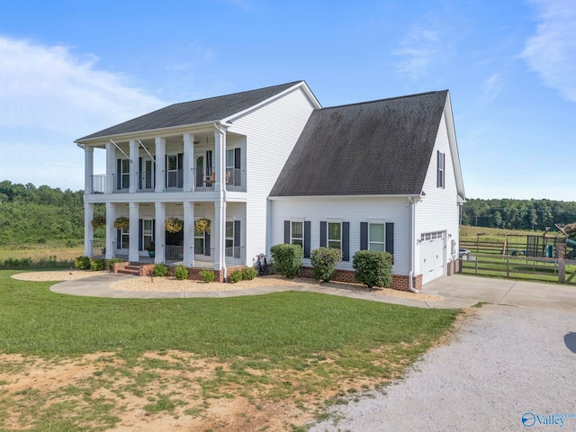 254 Whitlow Rd, Decatur, AL 35603 - view of front of home with a balcony, covered porch, a garage, concrete driveway, and roof with shingles