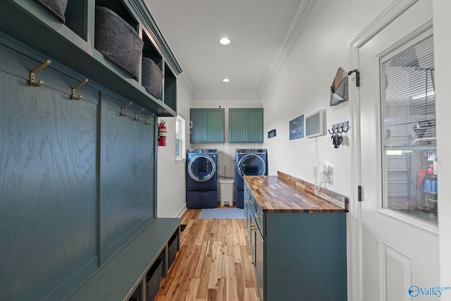 254 Whitlow Rd, Decatur, AL 35603 - laundry room with washing machine and clothes dryer, ornamental molding, cabinet space, light wood-style flooring, and recessed lighting