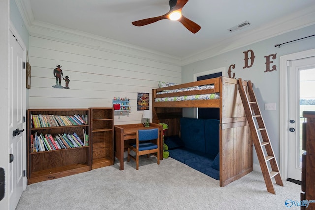 254 Whitlow Rd, Decatur, AL 35603 - carpeted bedroom featuring crown molding, ceiling fan, and wood walls