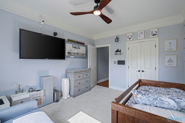 254 Whitlow Rd, Decatur, AL 35603 - bedroom featuring light carpet, ornamental molding, a closet, and ceiling fan