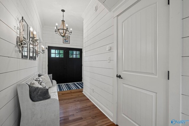 254 Whitlow Rd, Decatur, AL 35603 - entryway featuring a chandelier, wood finished floors, ornamental molding, and wood walls