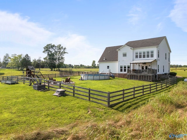 254 Whitlow Rd, Decatur, AL 35603 - back of house featuring a deck, a rural view, and roof with shingles
