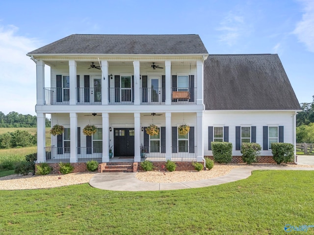 254 Whitlow Rd, Decatur, AL 35603 - greek revival inspired property with ceiling fan, a front lawn, and a balcony