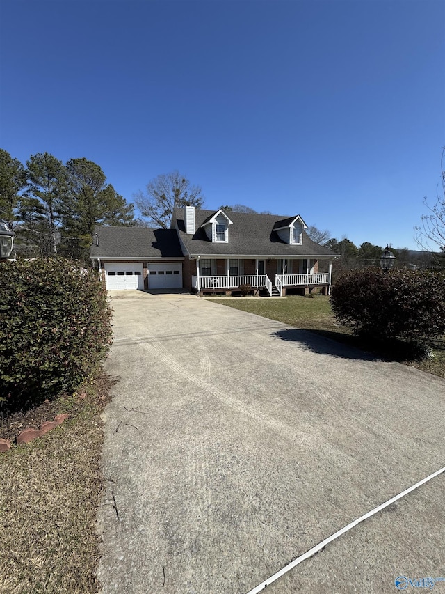 view of front of home with a porch and a garage