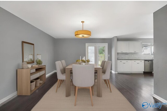 dining room with dark hardwood / wood-style flooring