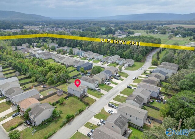 birds eye view of property with a mountain view