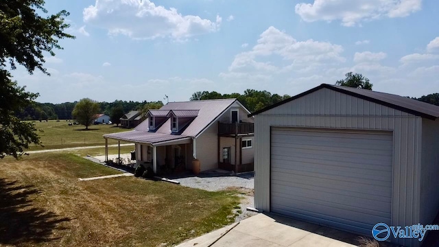 view of front of property with a garage and a front lawn