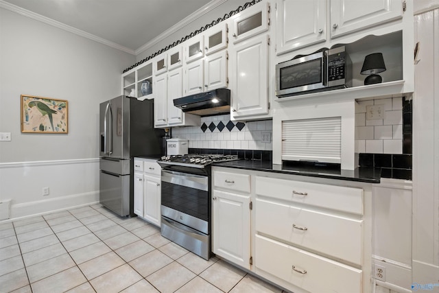 kitchen with white cabinetry, tasteful backsplash, crown molding, light tile patterned floors, and appliances with stainless steel finishes