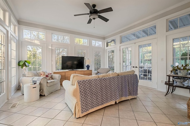 sunroom / solarium with french doors and ceiling fan