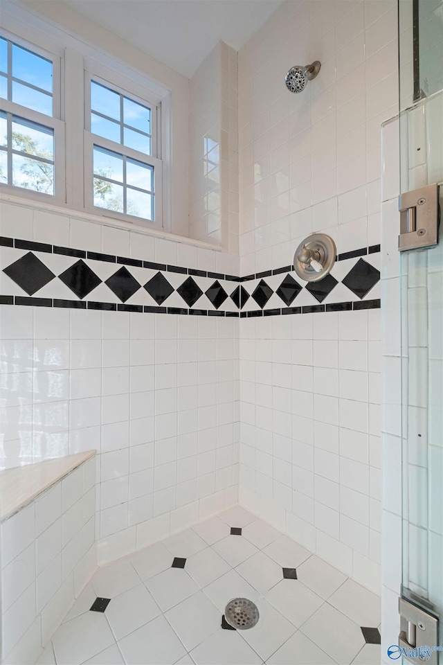 bathroom with tiled shower