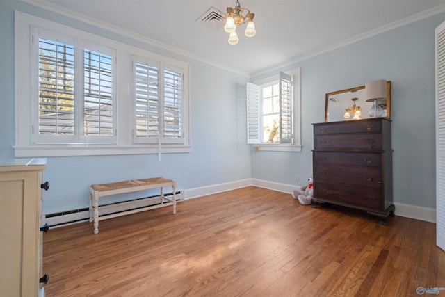 miscellaneous room with a chandelier, hardwood / wood-style flooring, a baseboard radiator, and crown molding