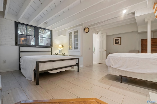 bedroom featuring beamed ceiling and wooden ceiling