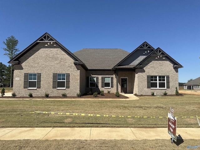 craftsman-style home with a front lawn