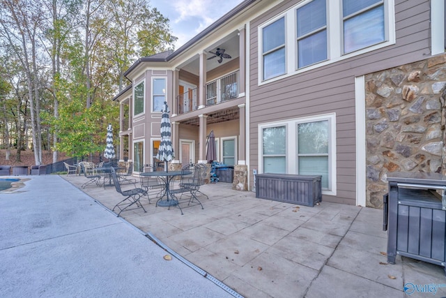 view of patio featuring ceiling fan