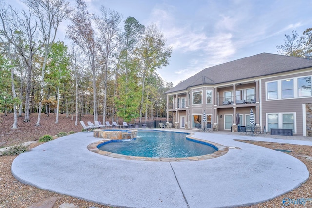 view of pool featuring an in ground hot tub and a patio area